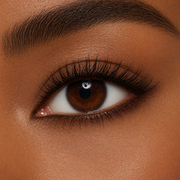 Close-up of a brown eye with a smokey eyeliner in Dark Chocolate on an ethnic skin tone