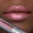 Close-up of a woman's lips wearing Runway Rogue long wear liquid lipstick in the shade 'Boss Babe'