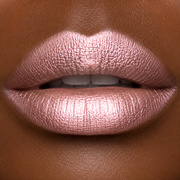 Close-up of a person's lips with a metallic pink lipstick by Runway Rogue in the shade 'Soft Box' 
