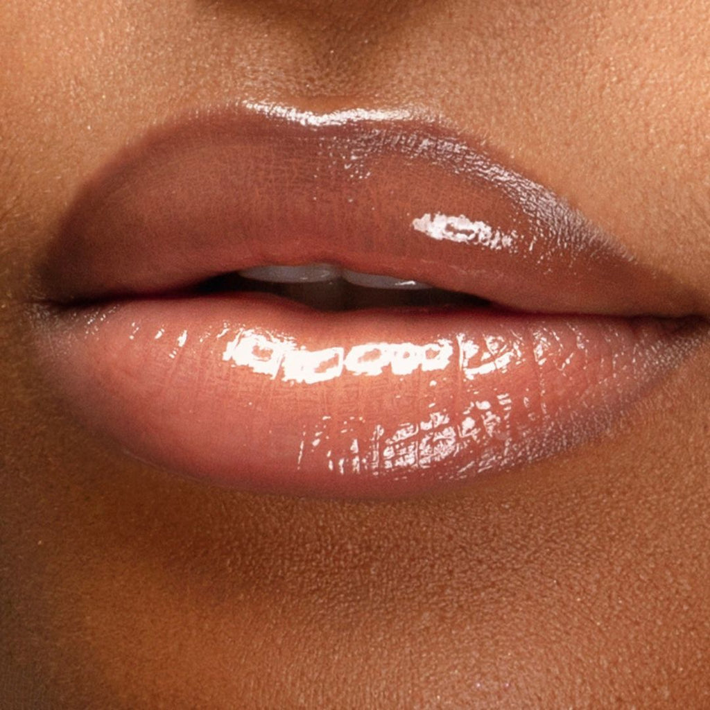 Runway Rogue Plump N’ Fill Lip Treatment applied for glossy, non-sticky shine and visible plumping effect
