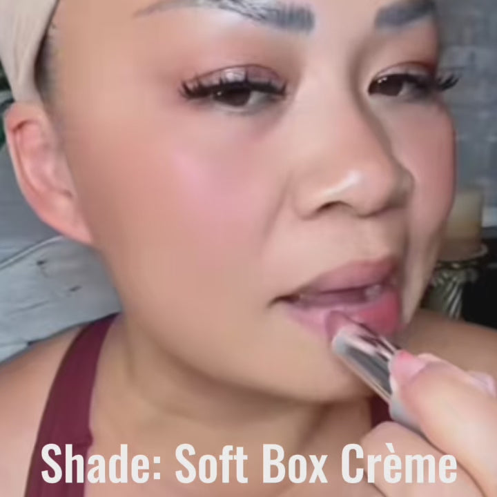 Video of a woman applying Runway Rogue Satin Shimmer Crème Lipstick in Soft Box, a bestselling nude pink shimmer shade