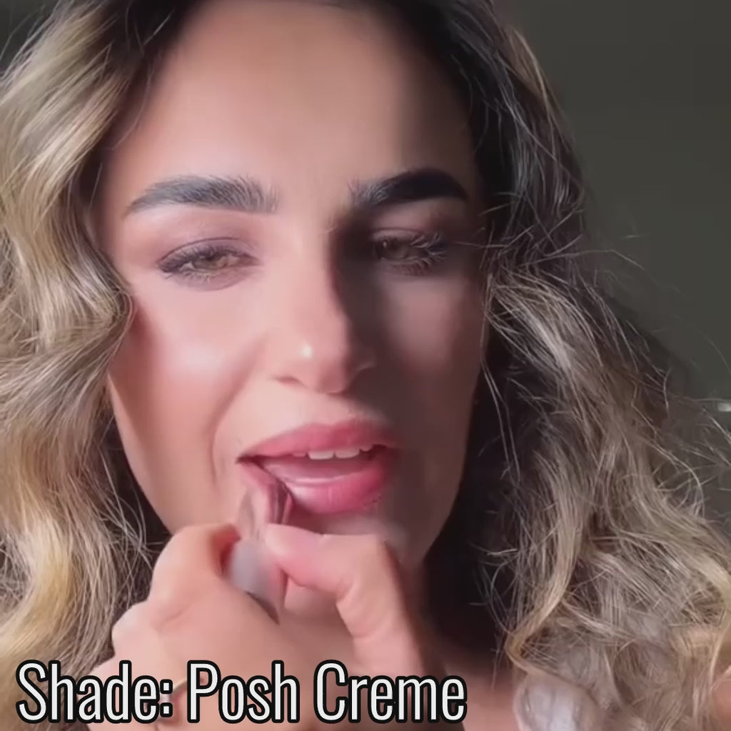 Close-up video showing smooth application of Satin Shimmer Crème Lipstick in 'Posh Creme' a soft golden nude lipstick with a frosted, luminous finish.”