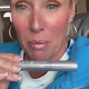 Close-up of woman demonstrating the long-lasting wear of Runway Rogue Long Wear Liquid Lipstick in Soft Box