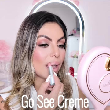 Video of a woman applying Runway Rogue Satin Shimmer Crème Lipstick in Go See Crème, a frosted pink with gold shimmer shade