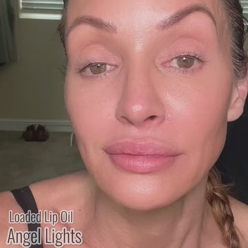 Runway Rogue founder Patricia Hartmann applying Loaded Lip Oil in the shade Angel Lights, a sheer opalescent pale pink
