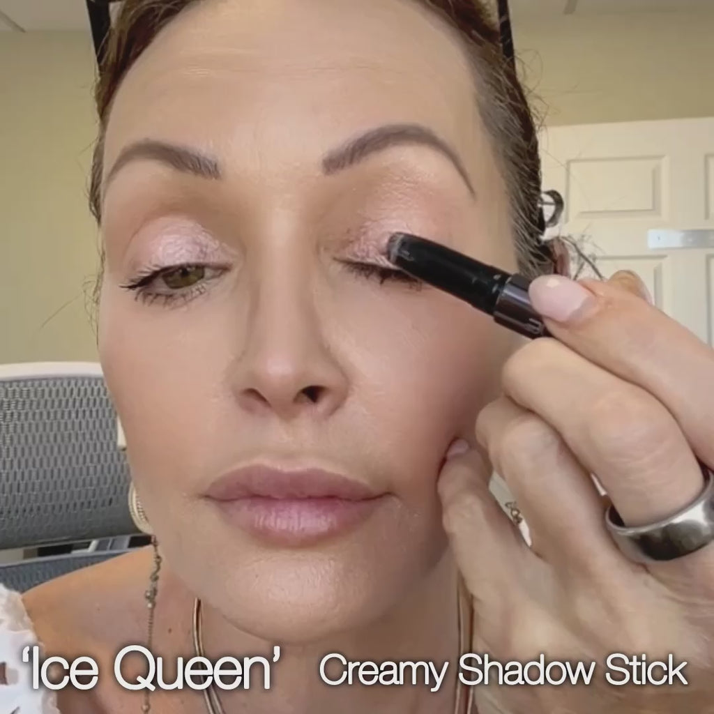 applying Runway Rogue EyeWakening eyeshadow stick in 'Ice Queen'